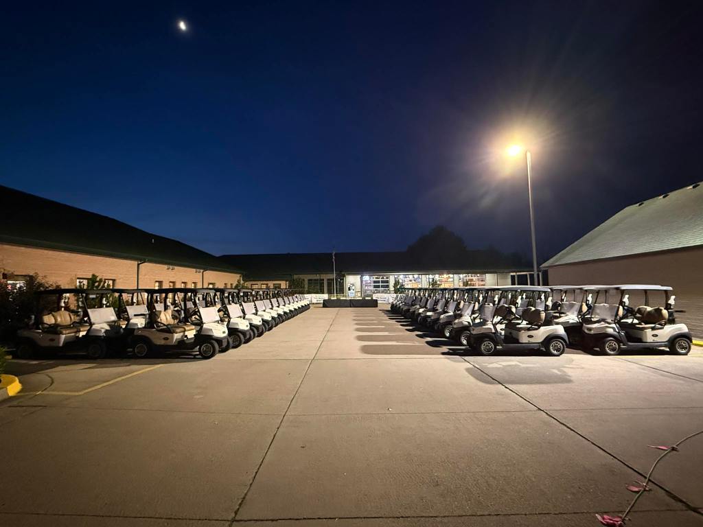 Golf carts lined up at course